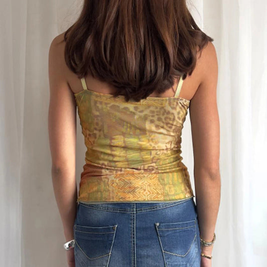 Elevate your summer style with the Gaono Y2K Vintage Women's Sleeveless Cami Top! This chic camisole showcases a unique abstract print and a charming ribbon tie-up front, perfect for layering or wearing solo. Crafted from lightweight broadcloth fabric