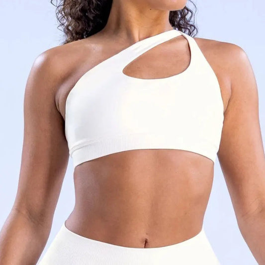 Discover the NCLAGEN Impact Asymmetric Sports Bra, designed for both style and performance. This high-support halter bra features a unique asymmetric design, perfect for yoga or intense workouts. Made from quick-dry, breathable nylon fabric, it ensures maximum